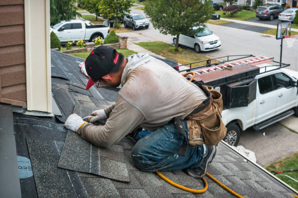 Professional Flat Roof Repair technician working in Adrian, OR